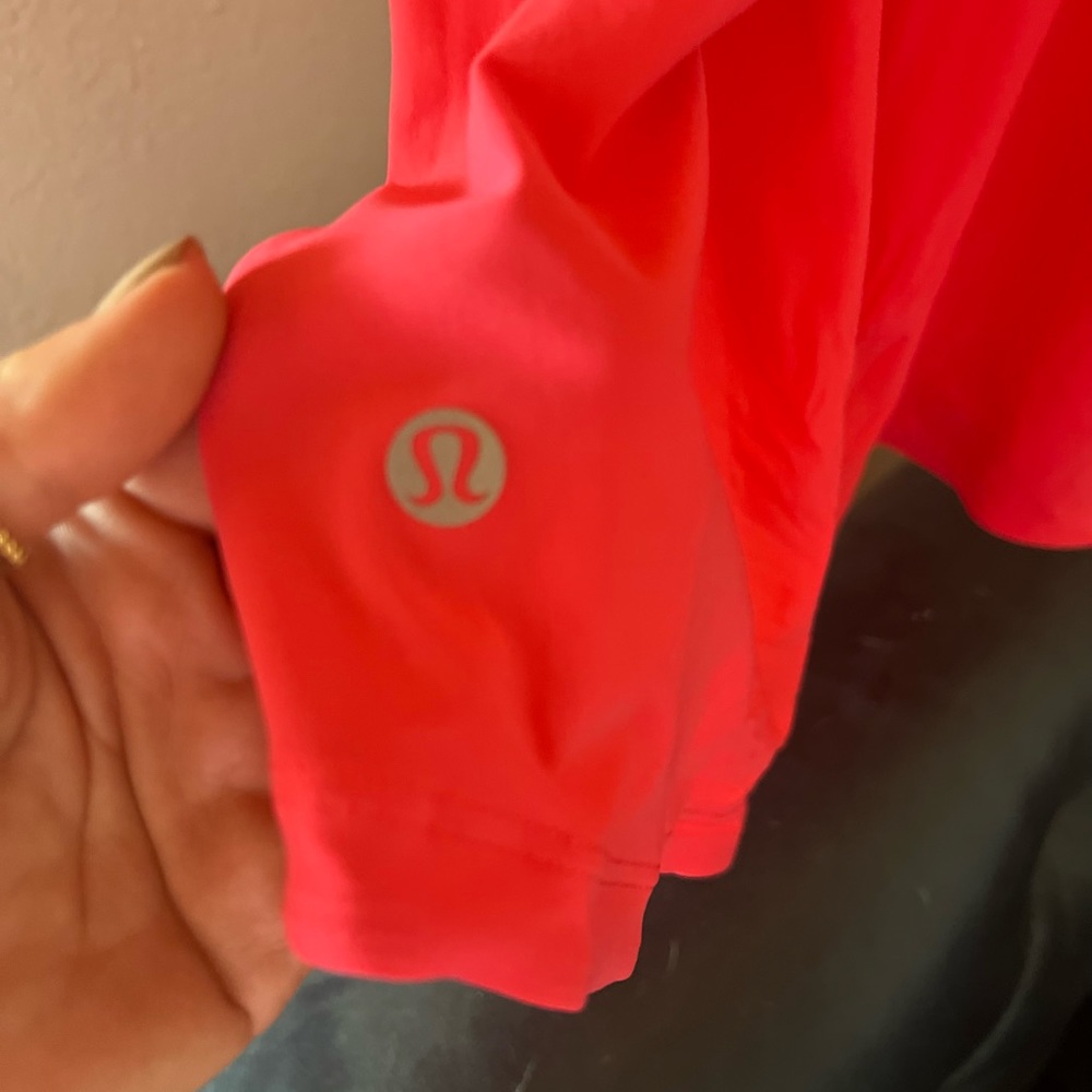Lululemon workout top size 4.  Pink/salmon color - Picture 2 of 6